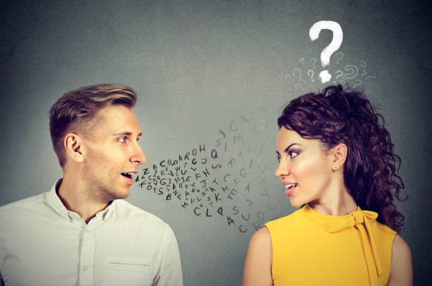 Surgery To Make Voice Deeper 2 Man Talking To An Attractive Woman With Question Mark Voice Therapy Stock Pictures, Royalty-Free Photos &Amp; Images
