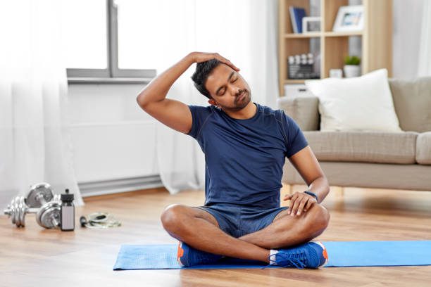 Surgery To Make Voice Deeper 4 Man Training And Stretching Body At Home Stretch Neck Stock Pictures, Royalty-Free Photos &Amp; Images