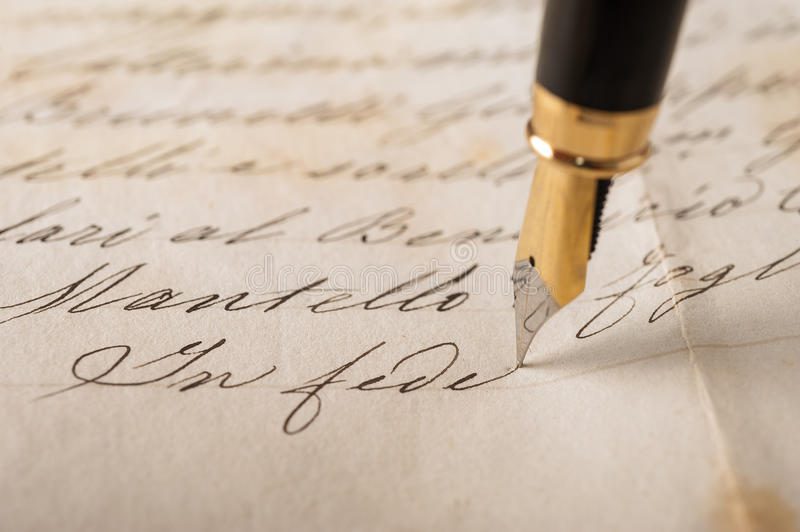 Fountain pen. Writing on an old handwritten letter stock images