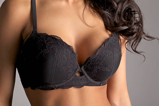 Bra and Breasts Close-up  bra stock pictures, royalty-free photos & images